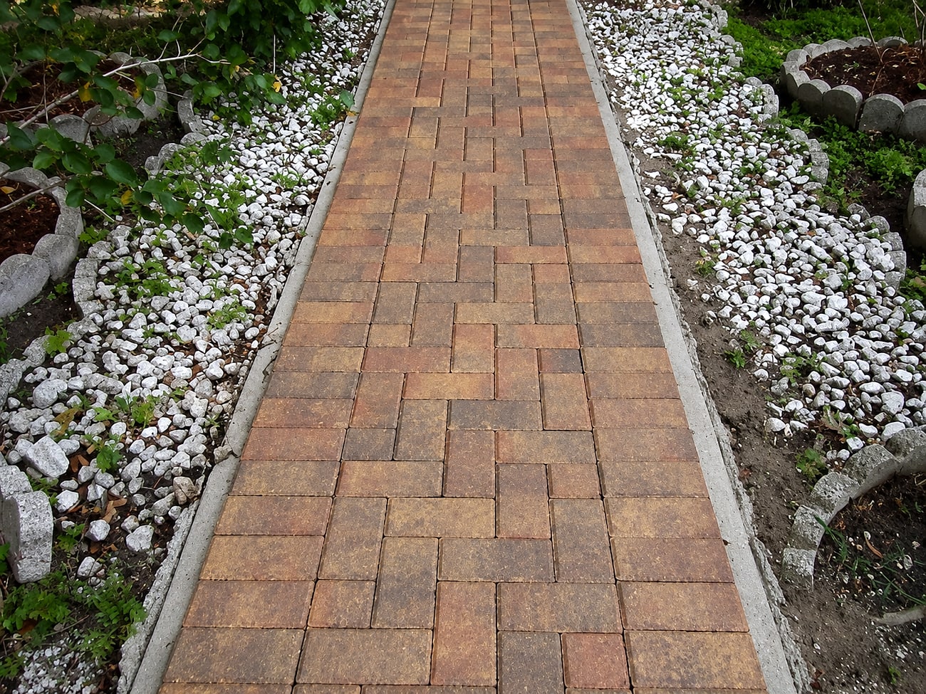 A finished paver walkway installed by Premier Lawn Care