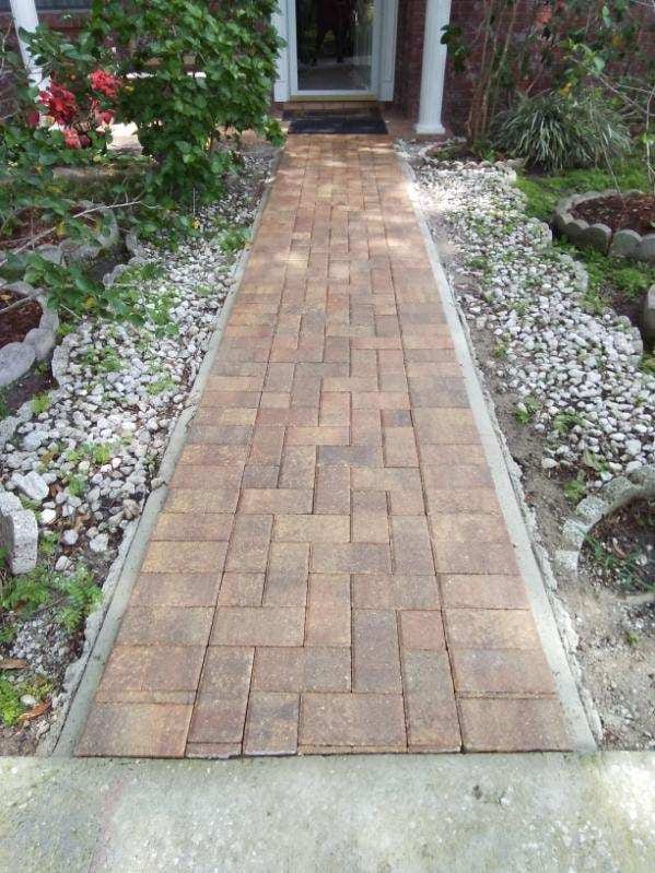 A herringbone-pattern paver walkway