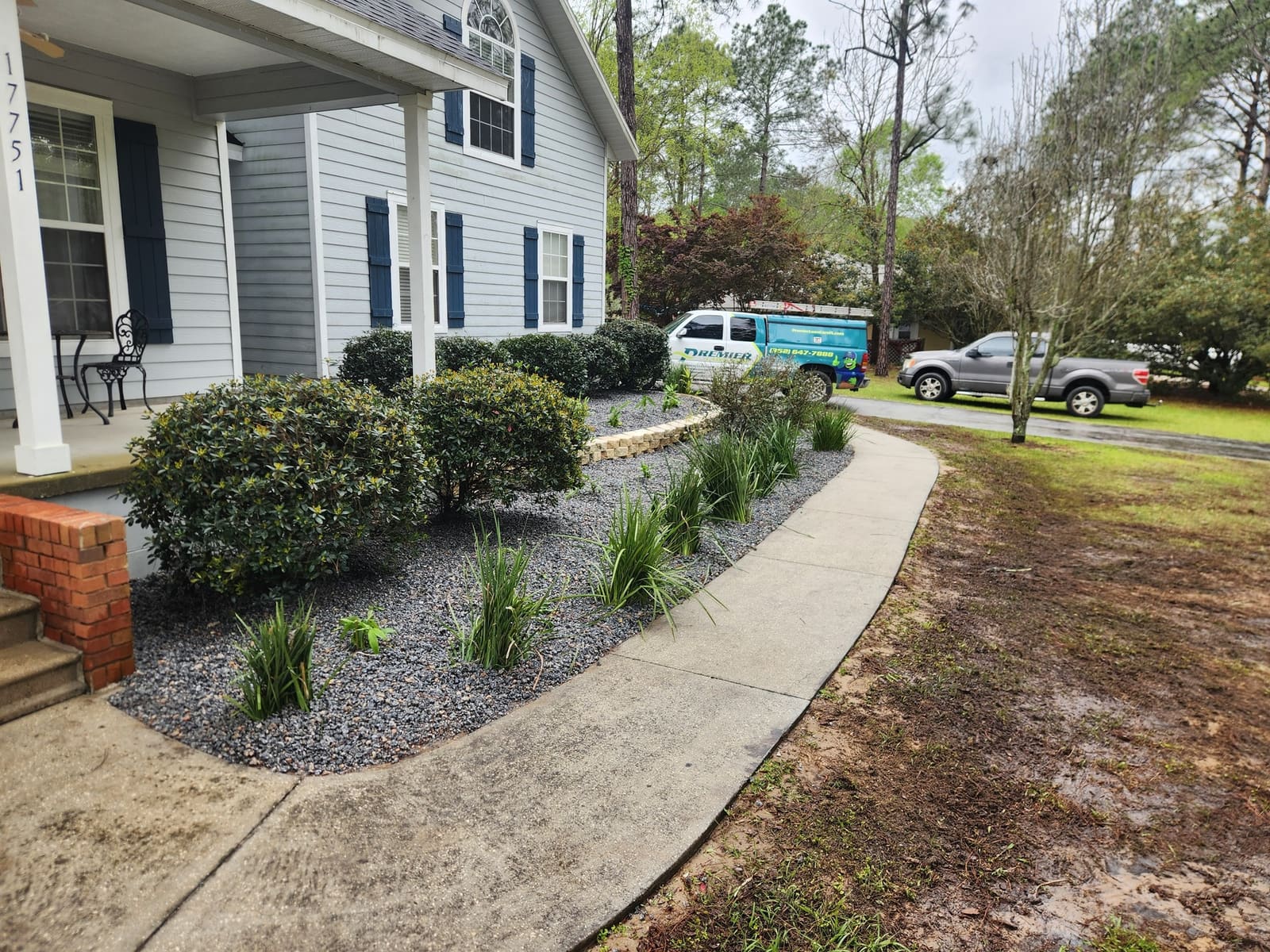 A newly sodded side yard along a wood privacy fence